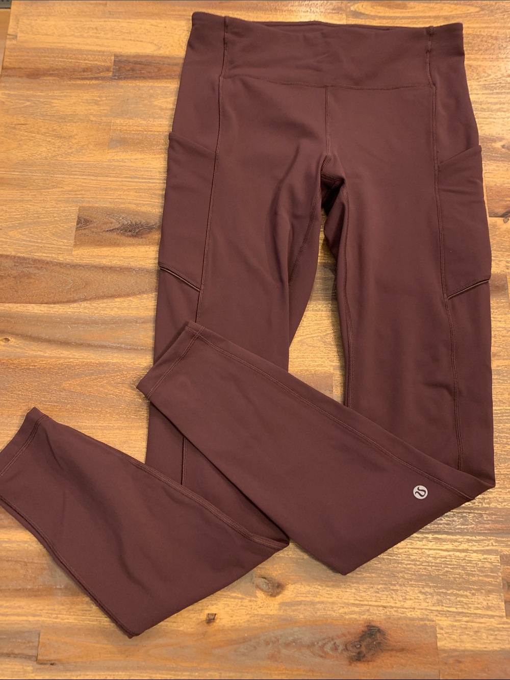 Lululemon tights with pockets. Deep plum/eggplant color. Size 6.
